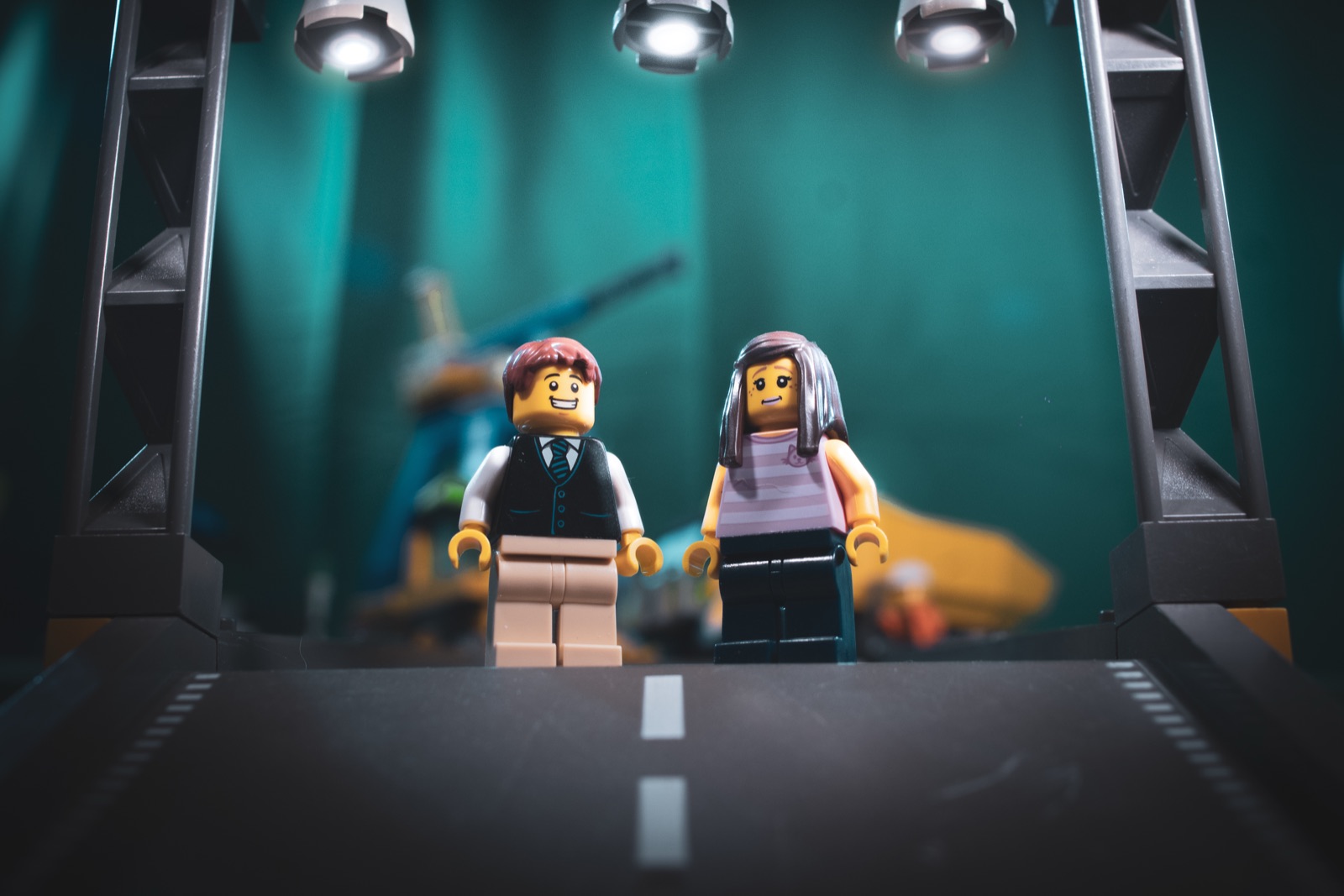 Lego figures on a small studio-lit stage