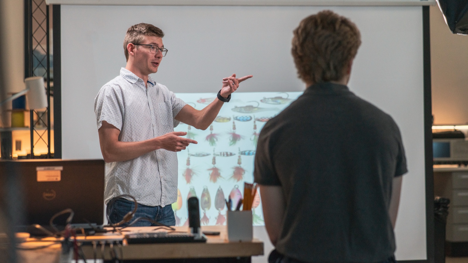 Intern presenting in front of a projected slide