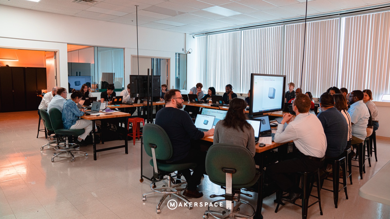 Full room of makers at laptops during the Intro to 3D CAD workshop