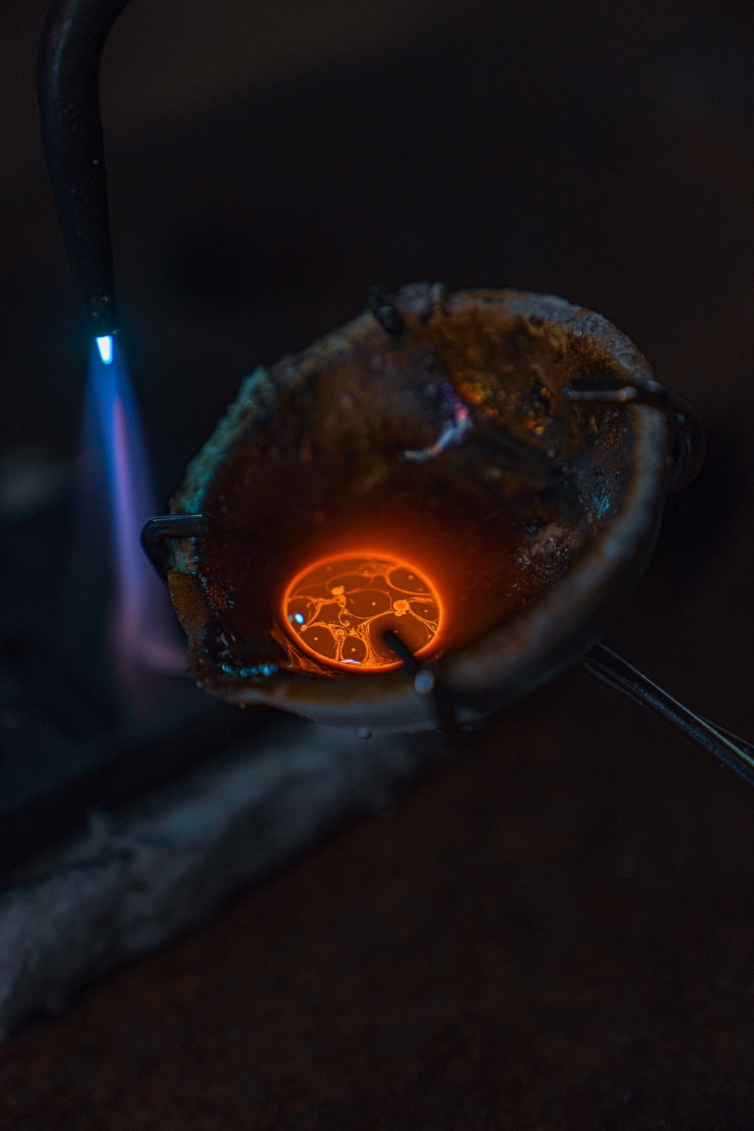 Glowing metal in a forge during a ring build